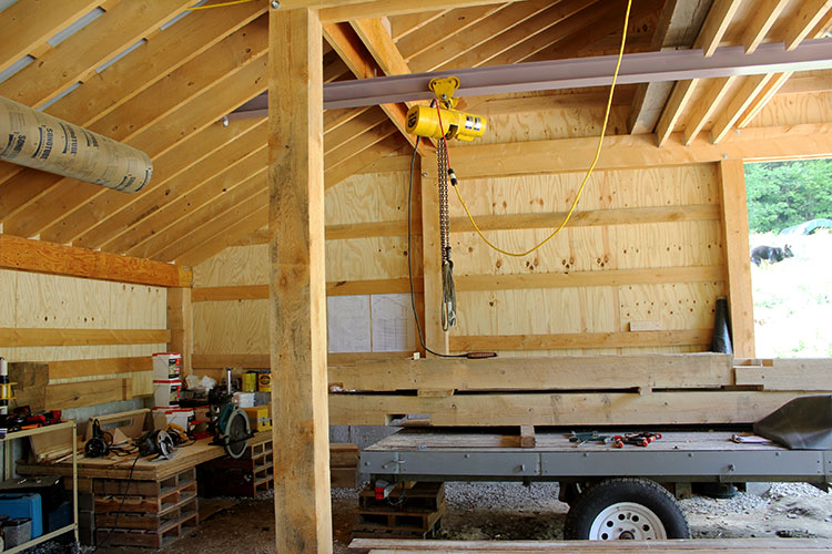 Interior western view of the solar-powered timber frame EV garage.