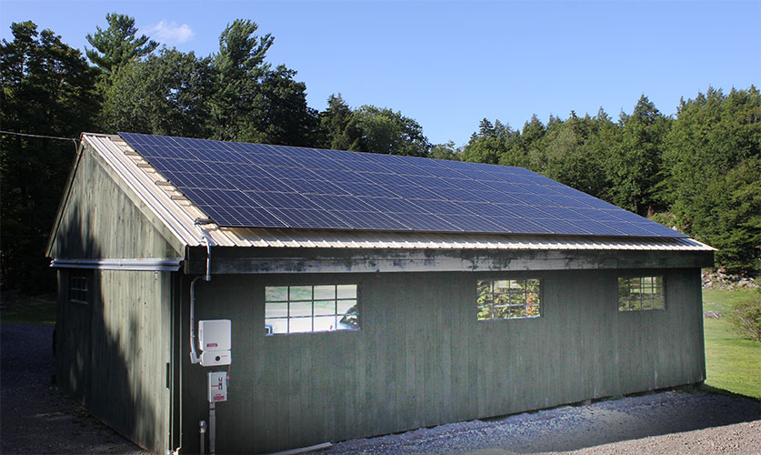 Solar array installed on a garage roof.