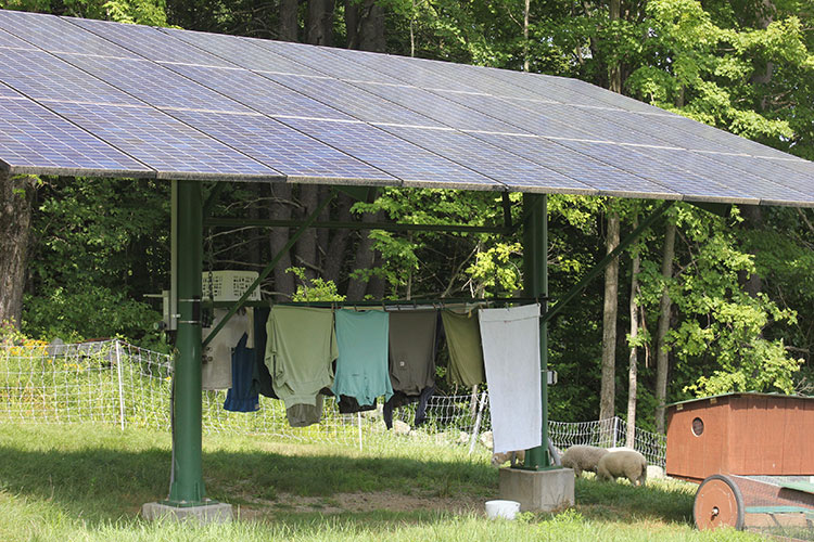 Pole-mounted array rigged with a custom clothes dryer.